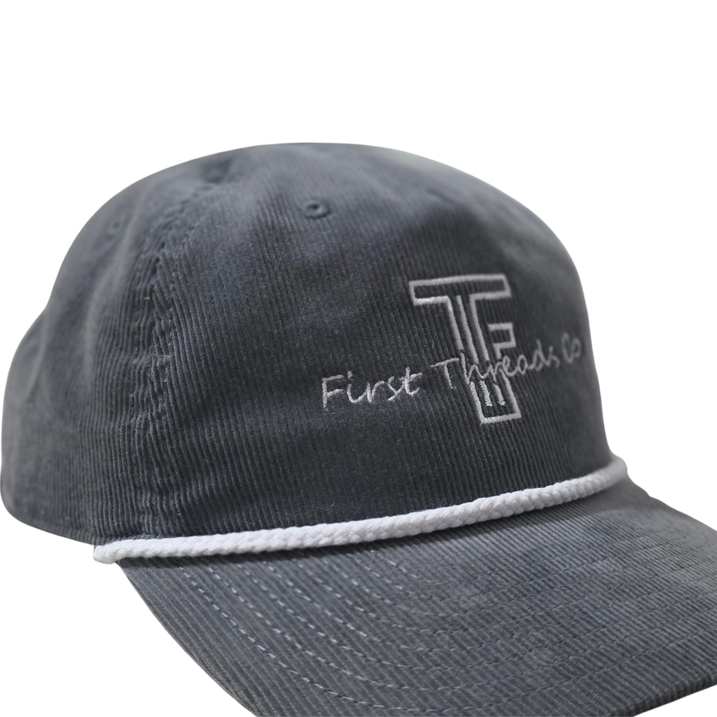 Gray cap with 'First Threads Co' logo on a white background